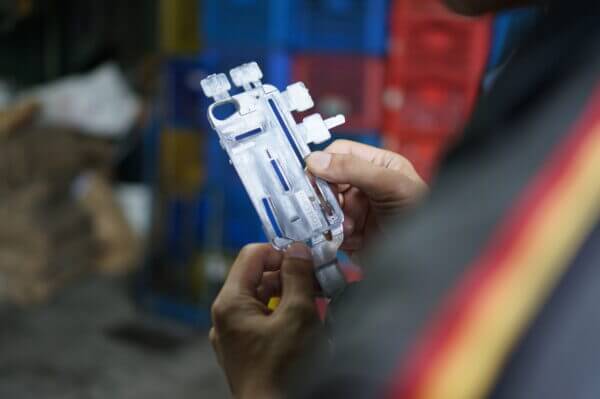 Hands holding a design for Manufacturing example