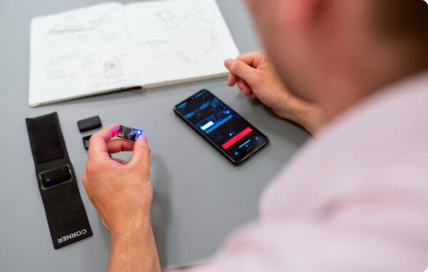 Design testing and validation - man testing device at table