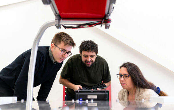 3 people parntering together for product development and engineering services