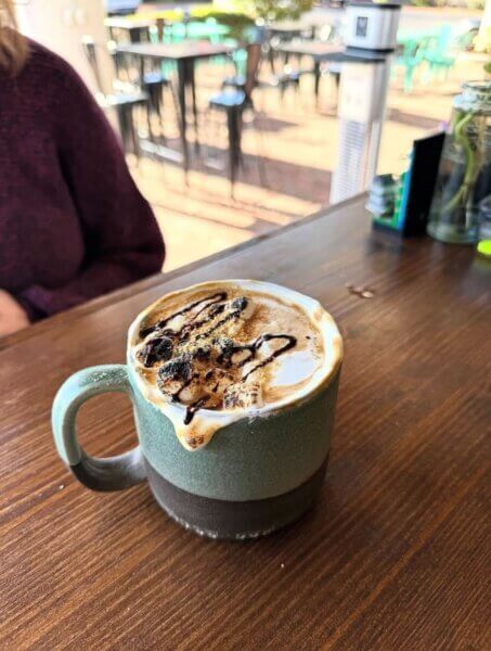 Coffee mug full of a latte at Coffee Box